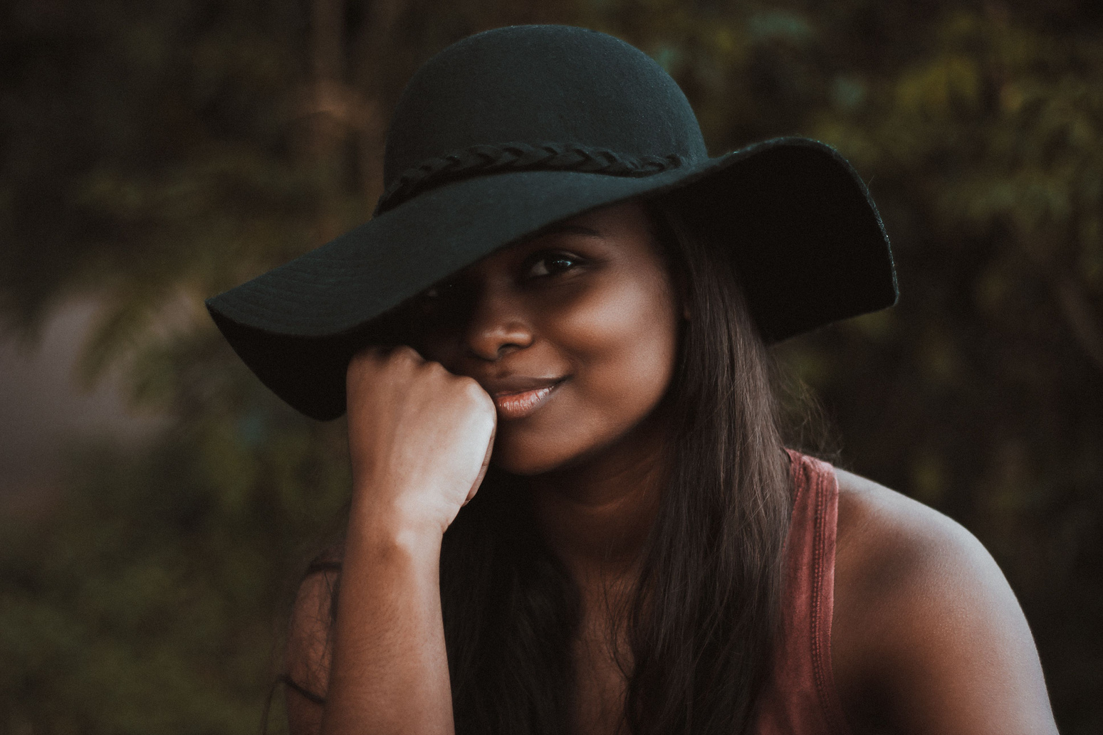 Smiling Woman Wearing Black Hat